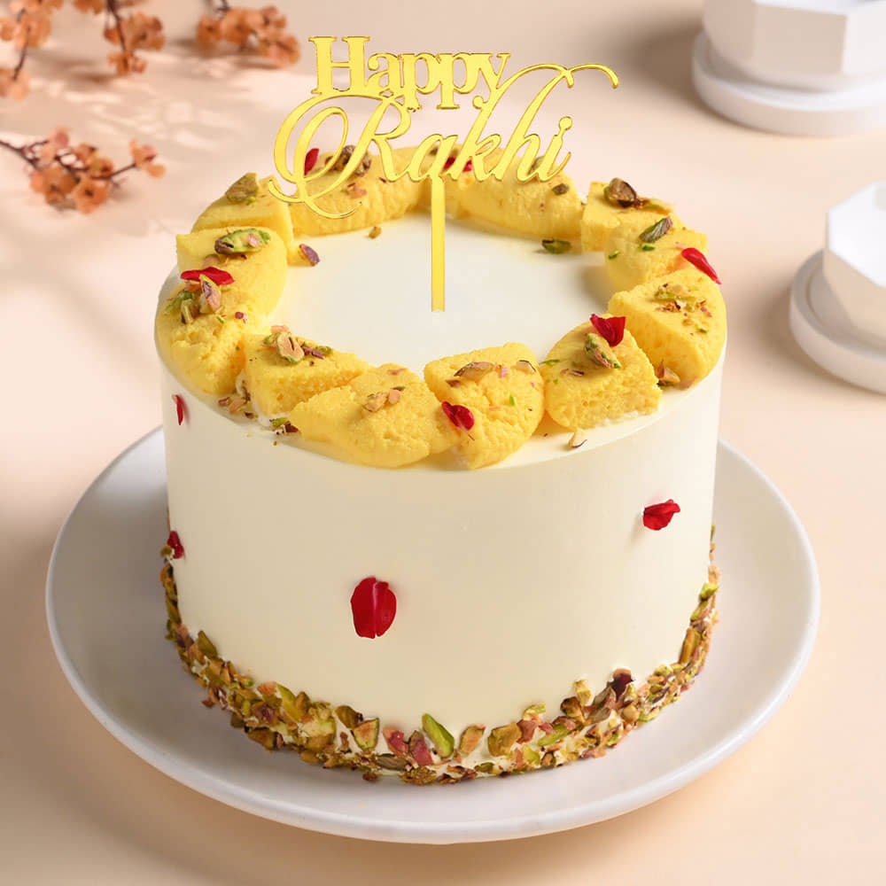 Rasmalai Cake With Two Peacock Designer Rakhis Front View of Rasmalai Cake With Rakhi