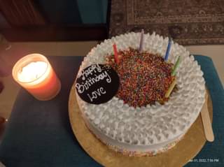 Sprinkles Topped Rainbow Cake