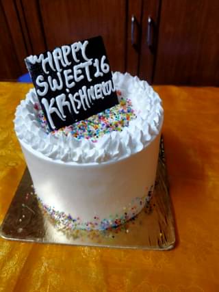 Sprinkles Topped Rainbow Cake