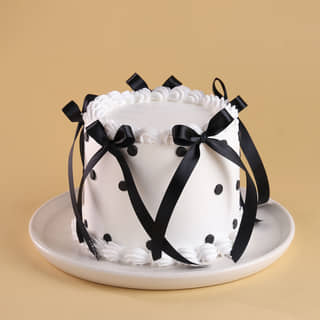 Front Angled View of Black N White Ribbon Cake