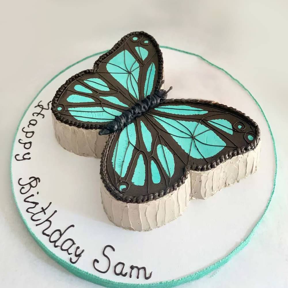 Side View of Blue Butterfly Cream Cake