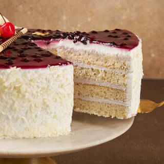 Sliced View of Blueberry Vanilla Cake with ingredients
