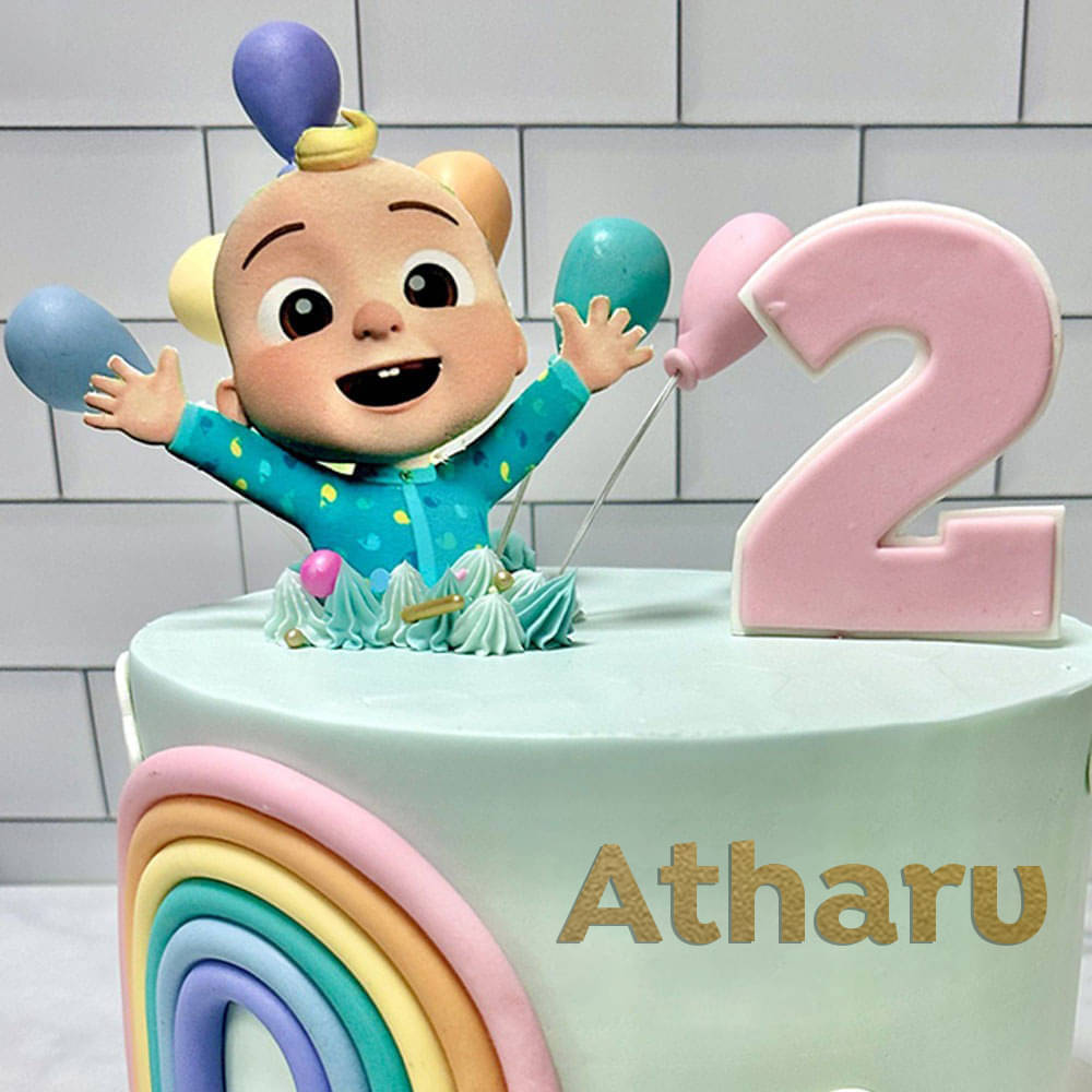 Top View of Cheerful Cocomelon Rainbow Fondant Cake