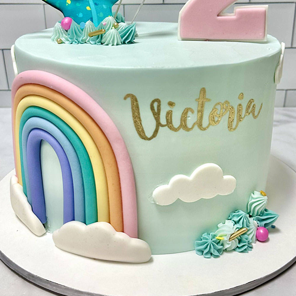 Side View of Cheerful Cocomelon Rainbow Fondant Cake