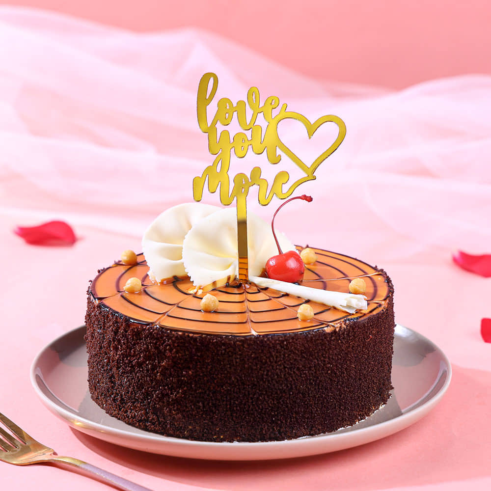 Side View of Cherry Butterscotch Cake With Love Topper