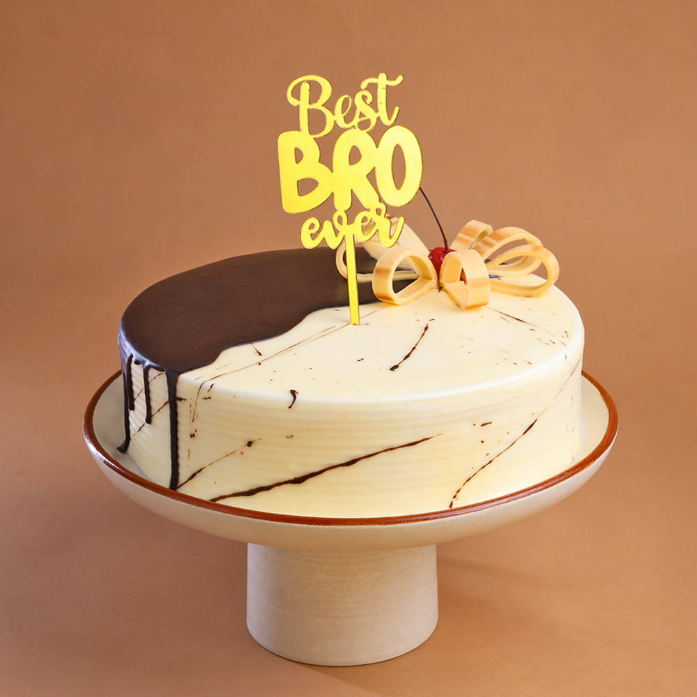 Top View of Choco Vanilla Brother Cake And Evil Eye Rakhi