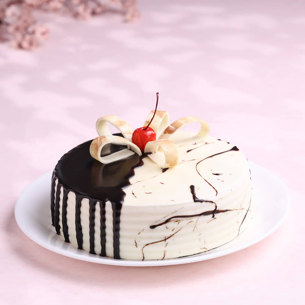 Front View of Chocolate & Vanilla Drip Cake