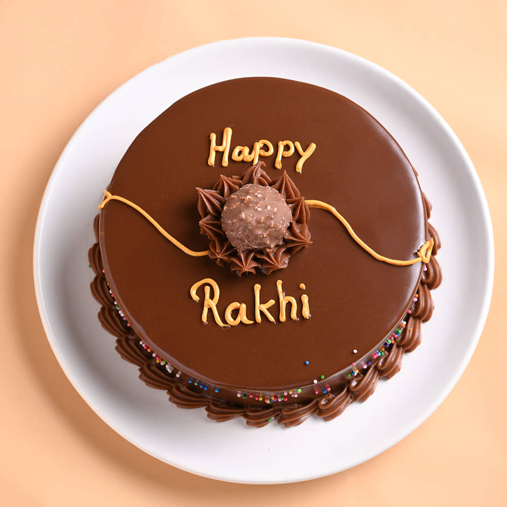 Choco Ferrero Rocher Cake N Floral Pearl Rakhi Top View of Chocolate Ferrero Rocher Cake With Peral Rakhi