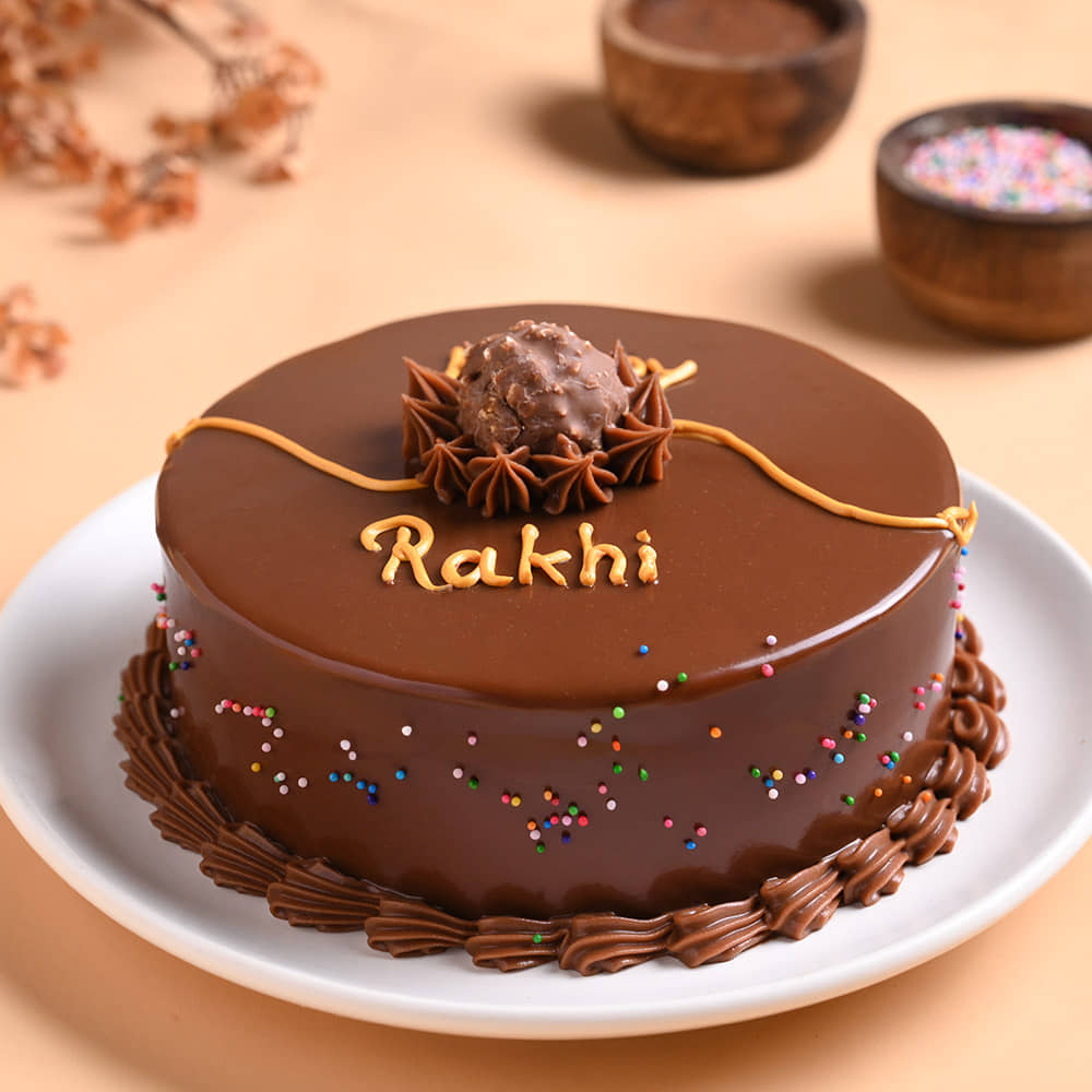 Choco Ferrero Rocher Cake N Floral Pearl Rakhi Front View of Chocolate Ferrero Rocher Cake With Peral Rakhi