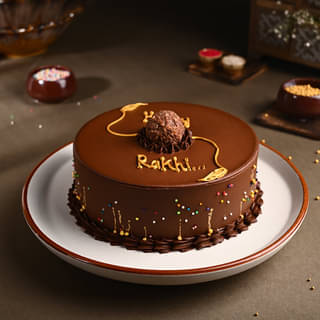 Side View of Chocolate Ferrero Rocher Cake With Floral Rakhi