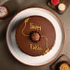 Top View of Chocolate Ferrero Rocher Cake With Floral Rakhi