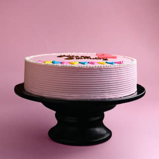 Side View of Happy Birthday Pink Cake Side View of Happy Birthday Pink Cake