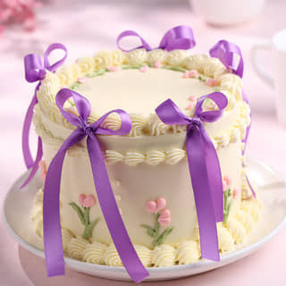 Front Angled View of Floral Swirls Ribbon Cake