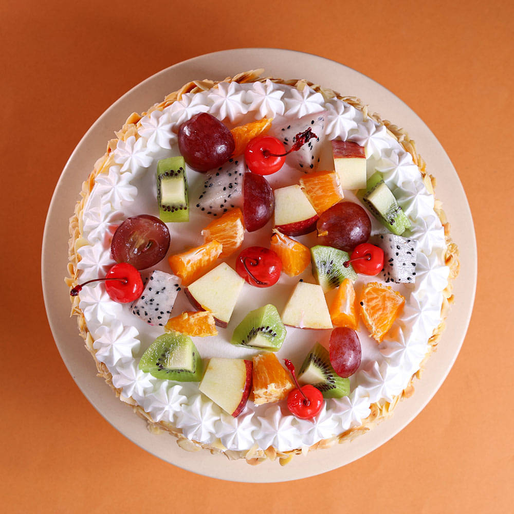 Top View of Fresh Fruits & Roasted Almonds Cake