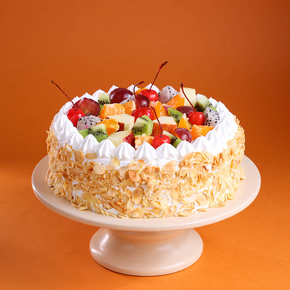 Front View of Fresh Fruits & Roasted Almonds Cake