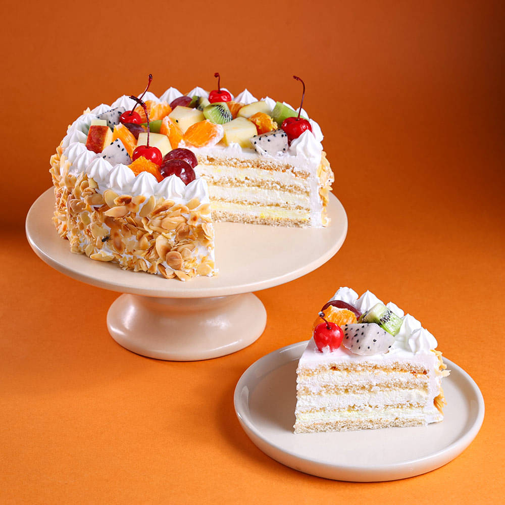 Sliced View of Fresh Fruits & Roasted Almonds Cake