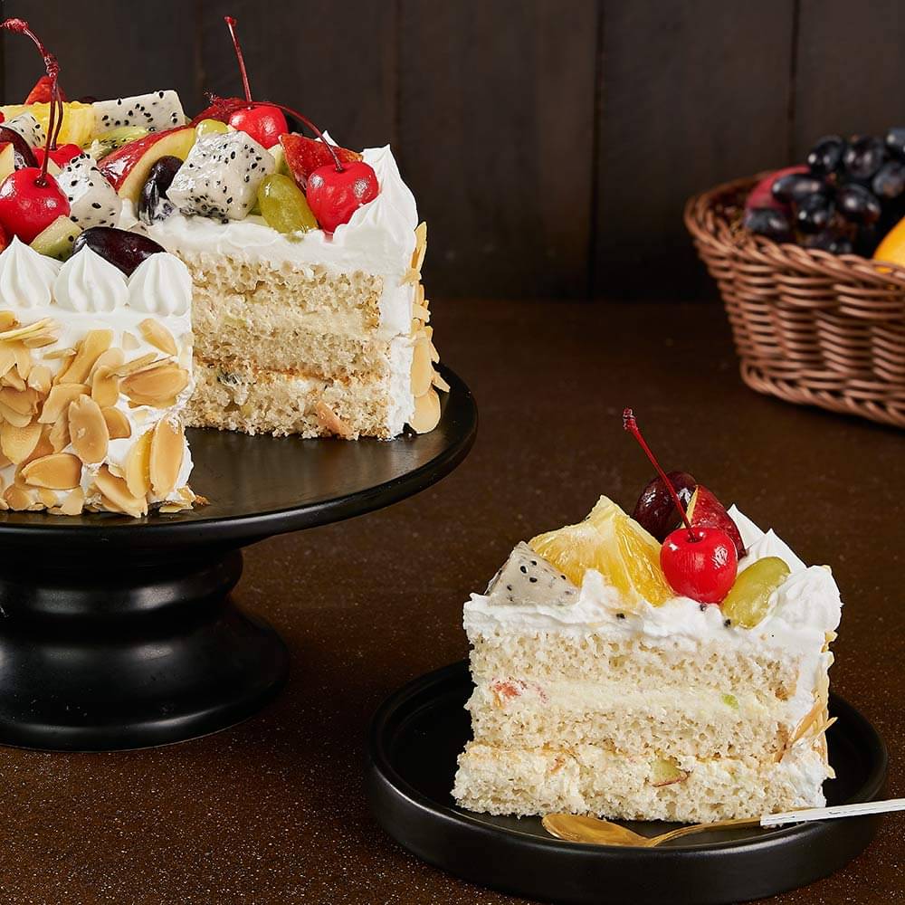 Sliced View of Fresh Fruits & Roasted Almonds Cake