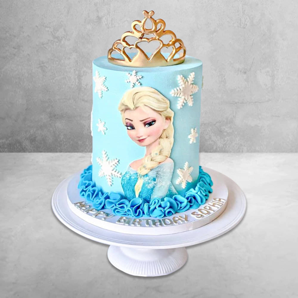 Large Frozen themed 1st birthday cake with Princess Elsa doll top tier  Frozen  birthday cake Elsa doll cake Elsa cakes