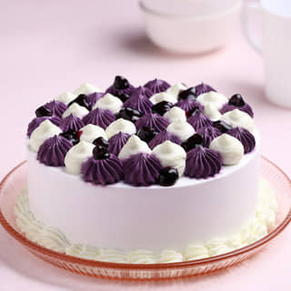 Front View of Glaze Drop Blueberry Cake