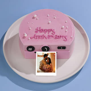 Front Angled View of Anniversary Camera Cakes