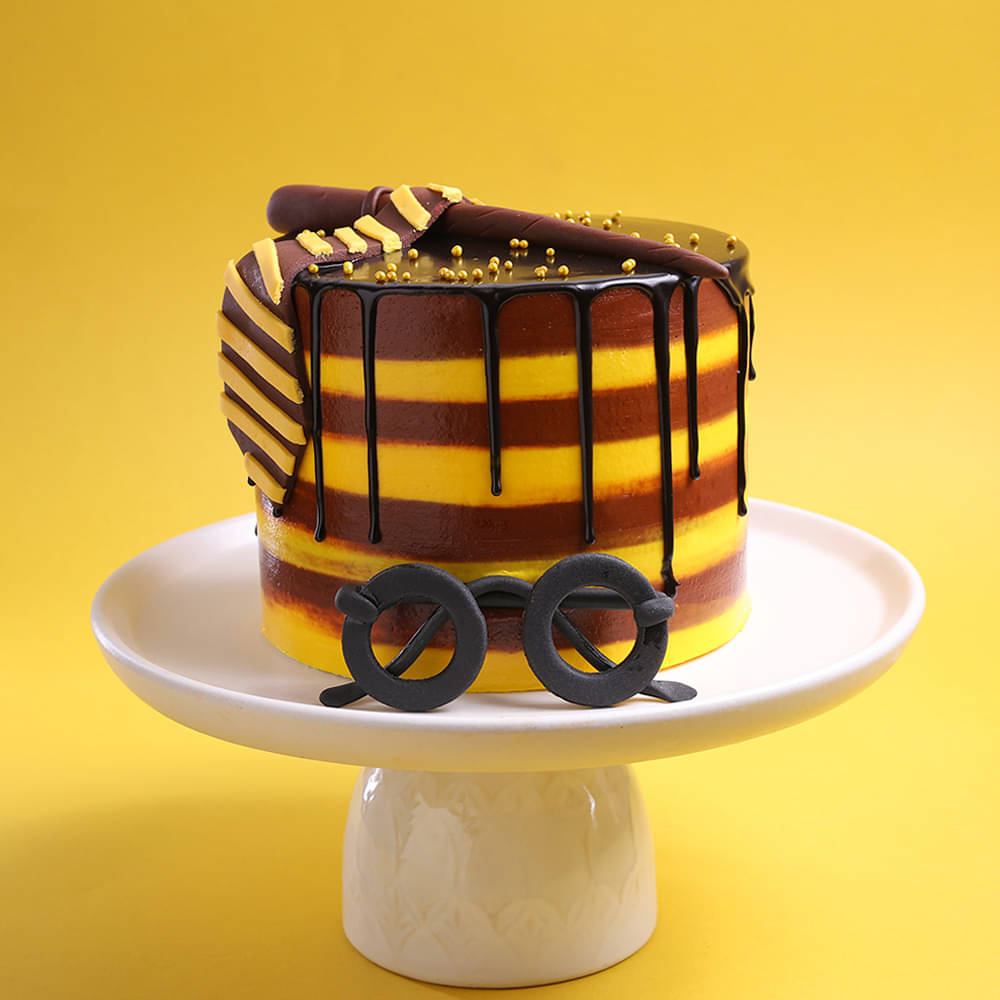 Yellow and Brown Harry Potter Cake with Tie and Wand