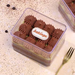 Kunafa Chocolate Tub with layered chocolate dessert and cream topping Kunafa Chocolate Tub with layered chocolate dessert and cream topping