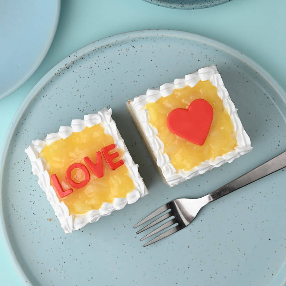 Top View of Love Blooms With Pineapple Pastry