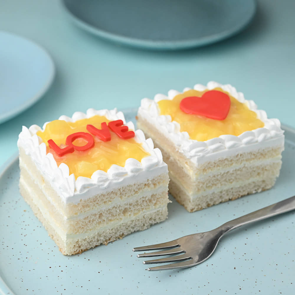 Side View of Love Blooms With Pineapple Pastry