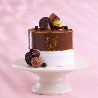 Milk Choco Indulgent Cake with chocolate toppings Milk Choco Indulgent Cake with chocolate toppings