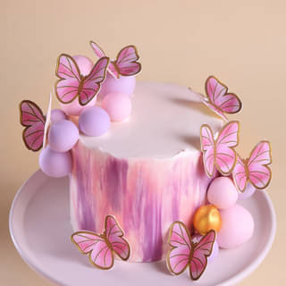 Purple Pink Watercolor Cake with Butterfly Toppers Purple Pink Watercolor Cake with Butterfly Toppers