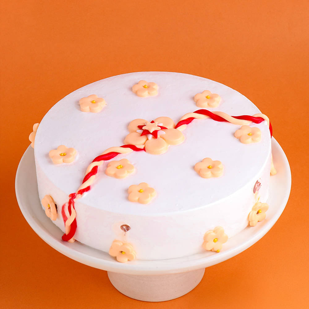 Top View of Pineapple Cake With Rakhi