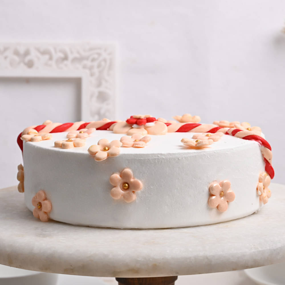 Side View of Pineapple Cake With Rakhi