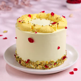 Side View of Rose Petals N Pistachio Rasmalai Cake Side View of Rose Petals N Pistachio Rasmalai Cake