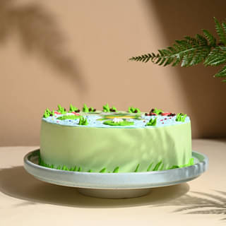 Side View of Playful Frog Paradise Cake