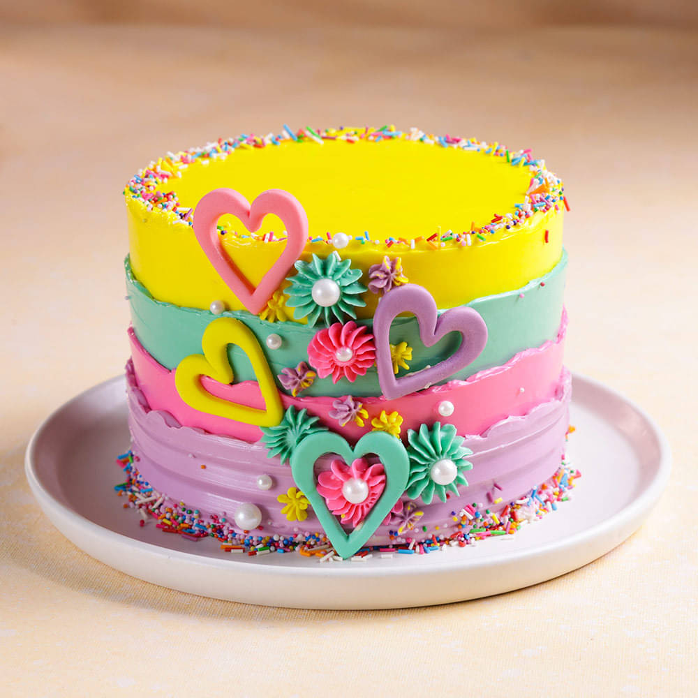 Side View of Rainbow Sprinkled Hearts Cake