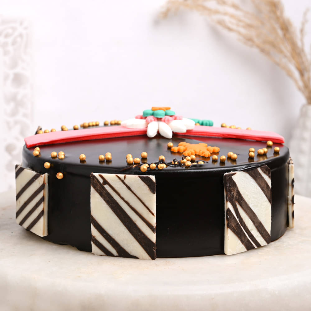 Chocolate Cake Topped With Rakhi Combo Side View of Raksha Bandhan Chocolate Cake With Rakhi