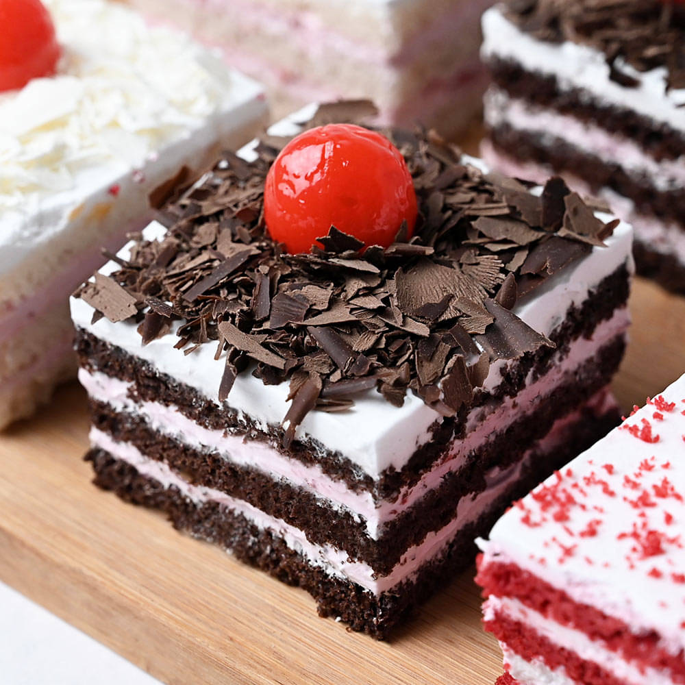 3 In 1 Pack Of Red Velvet Black And White Forest Pastries Side View of A Tasty Treat Pastry Pack