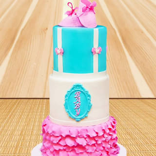 Three tier fondant cake with shoes on top
