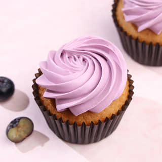 Blueberry cupcake with whipped cream frosting