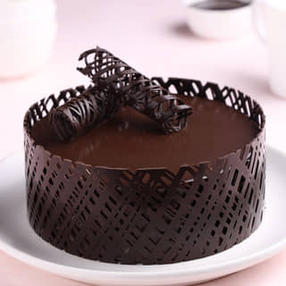Front View of Mirror Glaze Choco Truffle Cake Front View of Mirror Glaze Choco Truffle Cake
