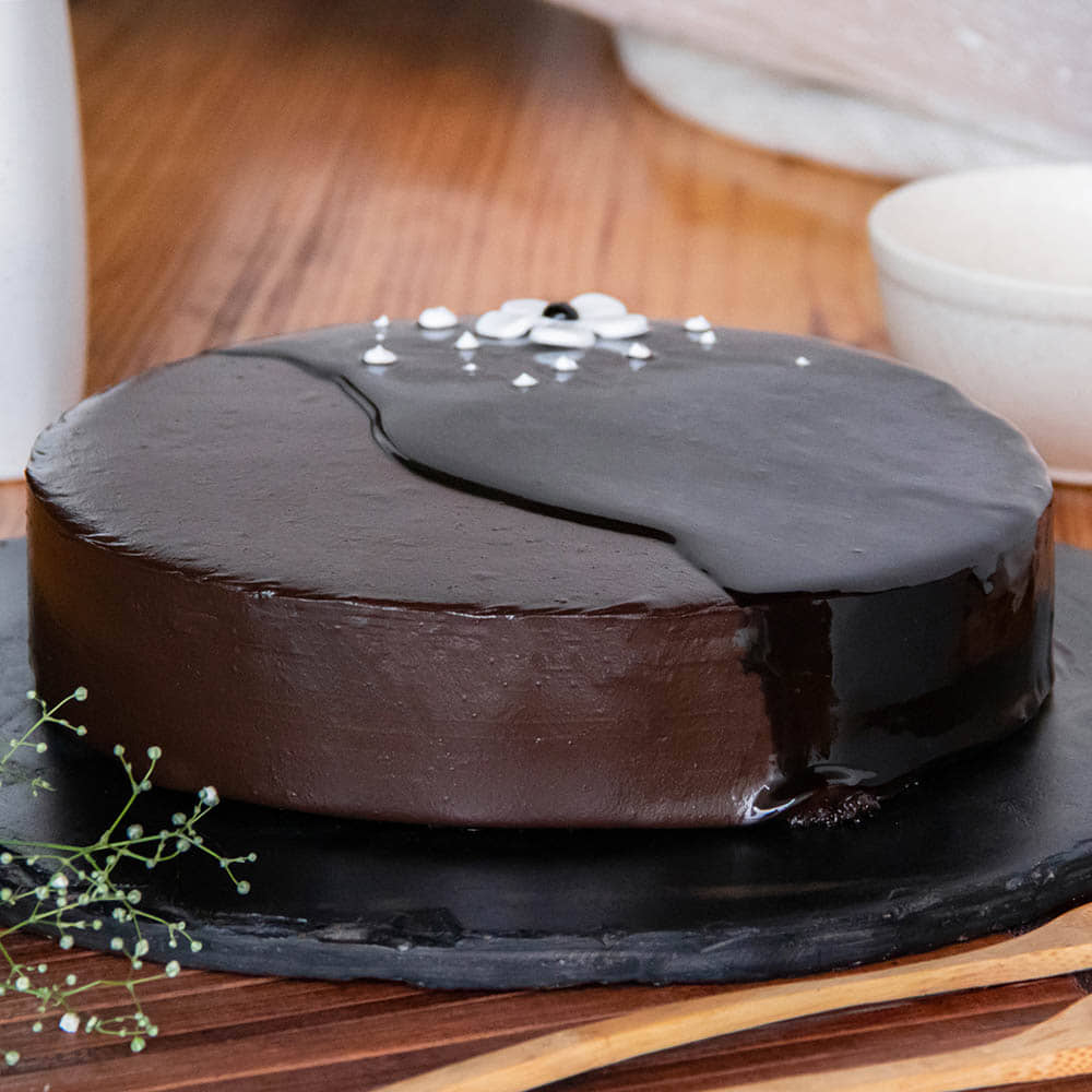 Floral Chocolate Glazed Cake Side View of Decadent Chocolate Glaze Delicacy