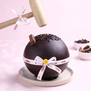 Ferrero Rocher Pinata Cake Front View of Ferrero Rocher and Kitkat Pinata Ball Cake