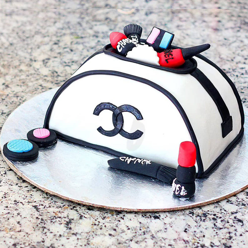 Chanel purse cake and cell phone cake and pearl cake with light pink cake  rose.PNG
