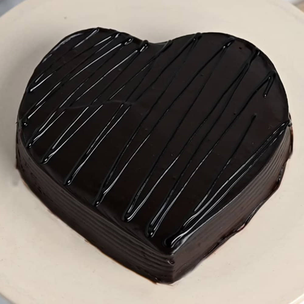 Chocolate Pinata Heart Shape Cake View of Heart in Heart Shaped Choco Pinata Cake