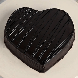 Top View of Heart Shaped Chocolate Pinata Cake For Valentines Day with Hammer