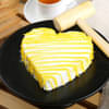 Side View of Heart Shaped Pineapple Pinata Cake with Hammer