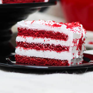 Sliced View of Red Velvet Cake With Choco Sticks