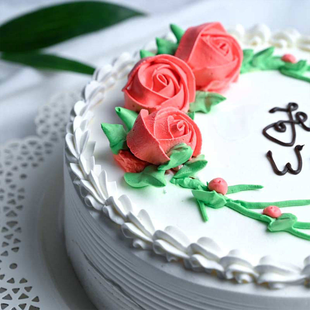 Blooming Vanilla Womens Day Delight Cake Side View Rosy Vanilla Cake for Women's Day