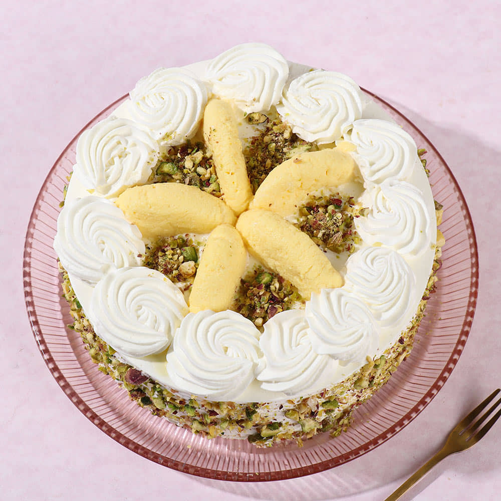 Rasmalai Pista Whipped Cream Cake Side View of Round Luscious Rasmalai Cake