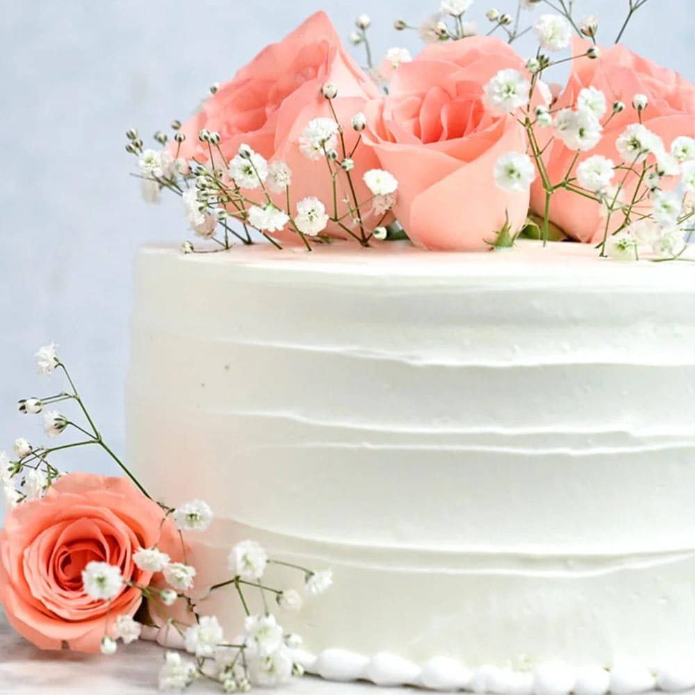 Side view of Creamy Vanilla Rose Cake 